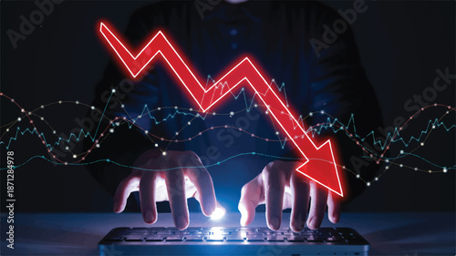 Person's hands typing on a keyboard with a red downward trending graph overlay computer
