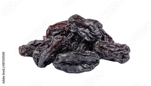 A pile of dark colored dried plums or prunes clustered together in a group showing their wrinkled texture and clean white background cutout