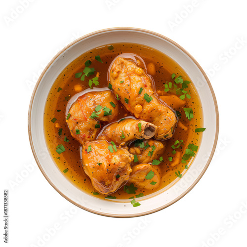 Chicken Stew With Herbs in Bowl With Broth and Bits of Vegetables Served on T...