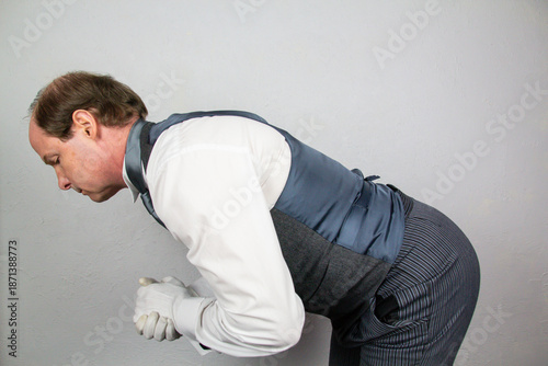 Foto Butler Bowing in Polite Manner to Honored Guest