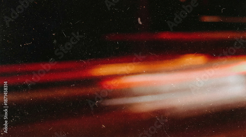 Fiery light leak overlay with orange red film burn streaks and dust texture, abstract cinematic flare background with retro grunge overlay effect, vintage analogue glow with soft blur and grain noise