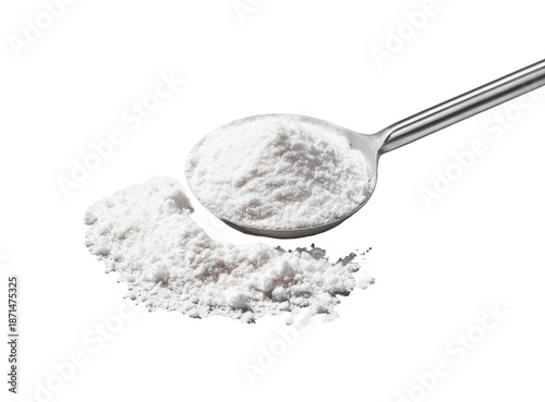 White powder in a metal spoon, with powder spilled