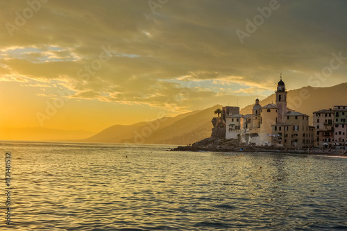 the fishing town of Camogli on the shores of the Mediterranean Sea in the ray...