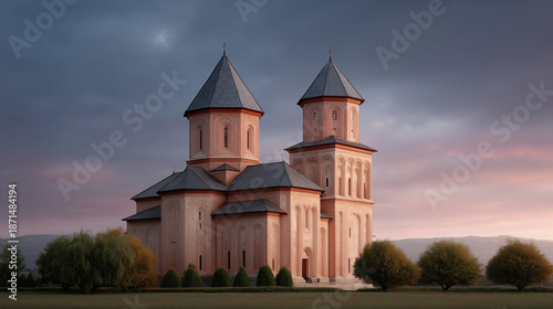 Orthodox church with twin towers at sunset, Eastern European religious architecture surrounded by trees and mountains in dramatic twilight sky