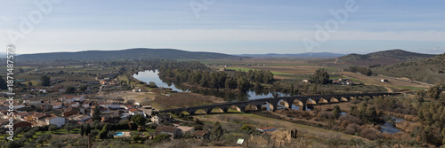 Landscape view of the ancient historic Roman bridge over the Guadiana river in Medellin Spain, a Spanish municipality in the province of Badajoz, in the autonomous community of Extremadura Spain.