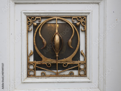 golden iron  ornament protecting a square window