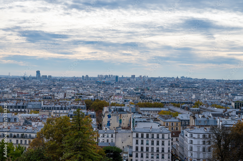 Fototapeta premium Walking on Montmartre hilly historical artistic district of Paris with famous buildings and narrow streets, tourists destination in France