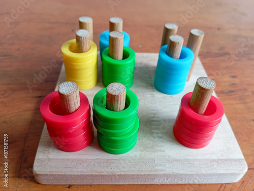 Montessori, toy stocking rings on a wooden board