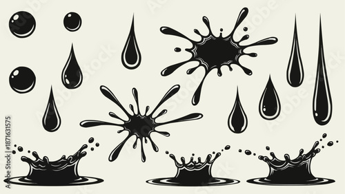 Black ink splashes and drops isolated on white background.