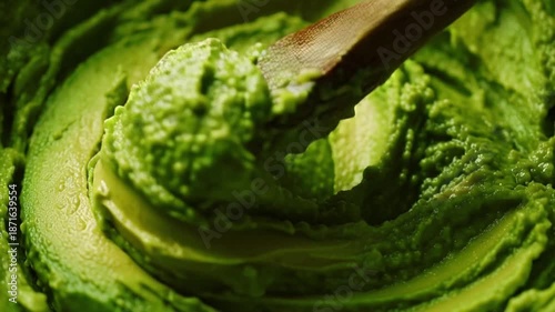 Guacamole Preparation with Wooden Spoon Closeup.