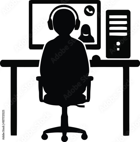 Silhouette of a person wearing headphones sitting at a desk with a computer