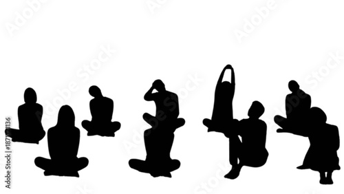 Silhouettes of multiple people engaged in various sitting yoga and stretching poses