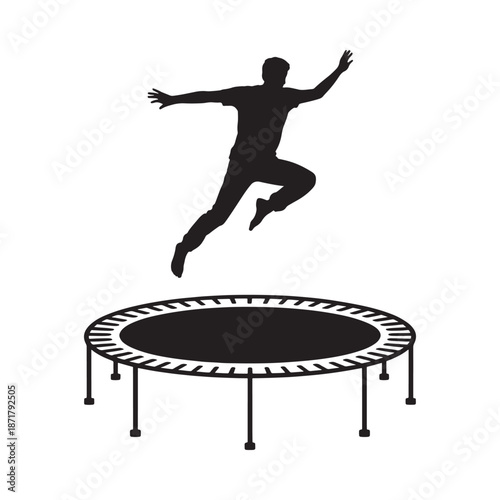 Silhouette of a person joyfully jumping on a round trampoline
