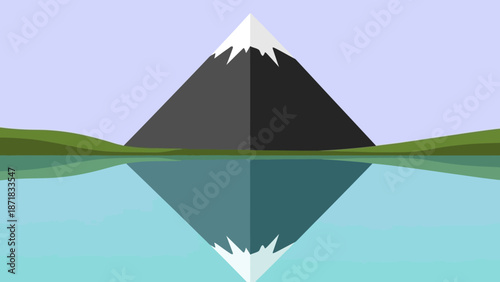 Serene mountain landscape with perfect reflection in calm water.