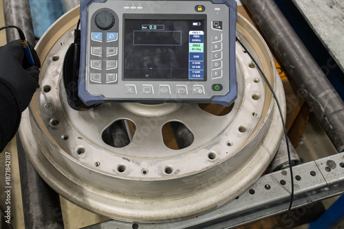 Aircraft Wheel Inspection Using Portable Eddy Current Testing Equipment and Probe Device. Non-Destructive Testing Method for Detecting Cracks and Defects in Aeroplane Landing Gear Components