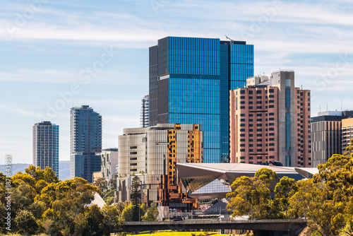 Fotografie Adelaide city skyline with modern buildings viewed along the Torrens Riverbank and Montefiore Bridge on a bright, clear day in South Australia