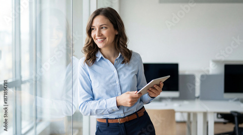 Business woman office tablet window smile professional confident business woman modern office holding tablet near window