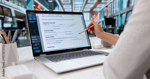 Tableau sur toile Woman Filling Out Health Insurance Claim Form On Laptop Computer