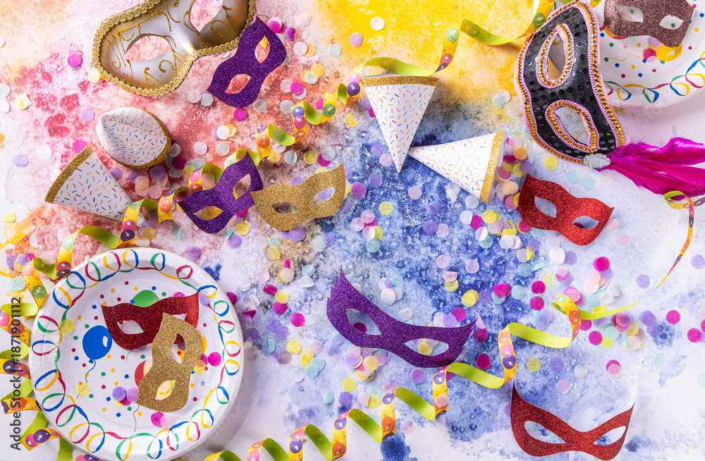 Fototapeta premium Party and carnival concept with masks, confetti and streamers