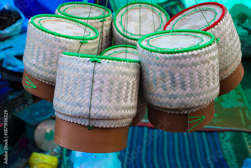 Handmade colorful clay pots and wicker baskets make a vibrant pink holiday decoration or gift box object for a festive Christmas celebration