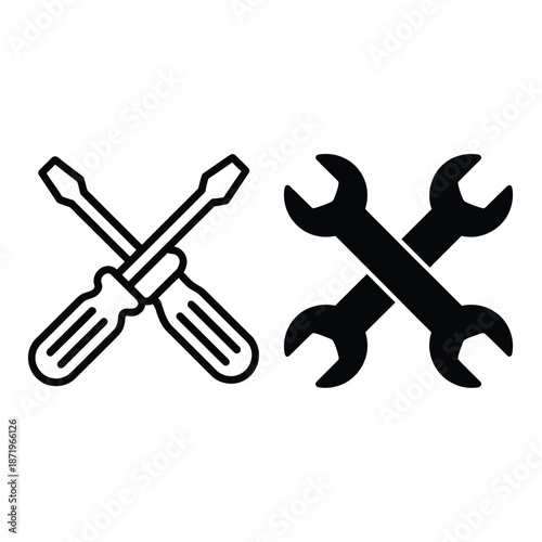 A crossed screwdriver and wrench essential tools for repairs and maintenance