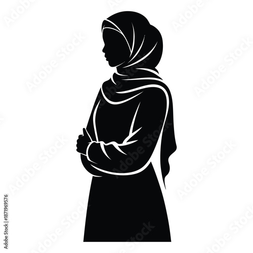 A striking silhouette of a woman wearing a traditional hijab and modest clothing arms crossed