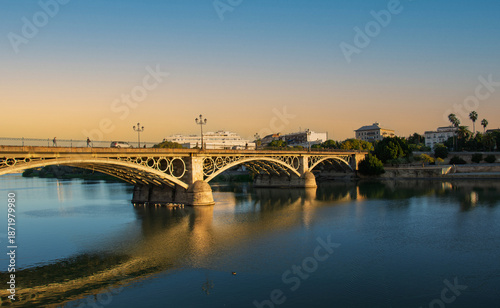 The historic Triana Bridge over the Guadalquivir River in one of the historic districts of the beautiful Andalusian city