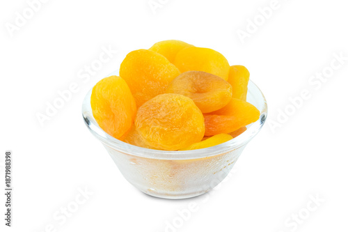 apricots in a bowl, Dried apricots in glass bowl isolated on white background with clipping path  close up stack, yellow dried fruits, snack and ingredient in recipes of food and bakery