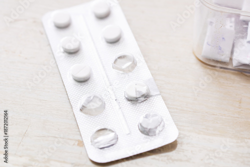 Medical environment showing prescription containers and organized pills for adherence