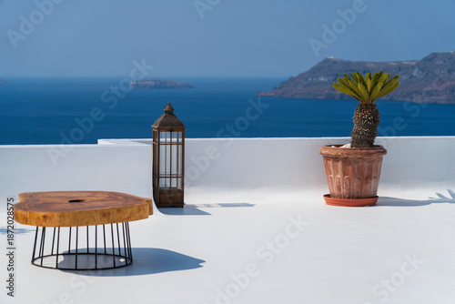 Old lantern with white washed wall - inspiring desire to travel in Oia, Santorini, Greece