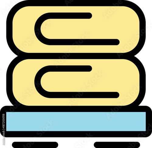 Soft folded towels are neatly stacked on a shelf, creating a relaxing atmosphere in bathroom or spa