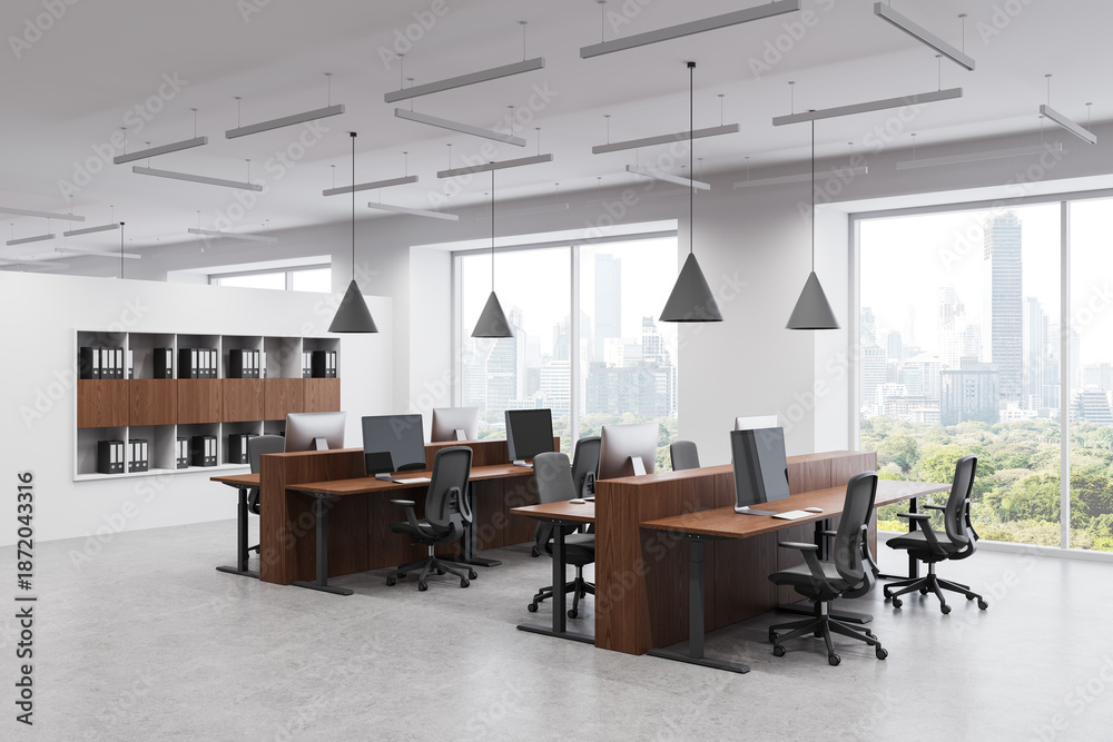 Fototapeta premium Modern office interior with wooden desks and computer workstations near large windows in high-rise building workspace concept. 3D Rendering