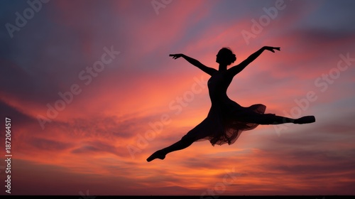 Wallpaper Mural Graceful Ballet Dancer Silhouette in Mid-Air Leap Against a Breathtaking Vibrant Sunset Sky Torontodigital.ca