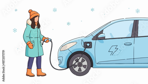A person in winter attire charges a light blue electric car while snowflakes fall around them