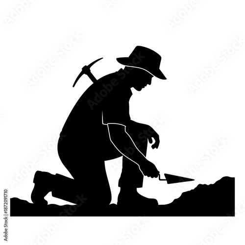 Silhouette of an Archaeologist Excavating with Trowel and Pickaxe.