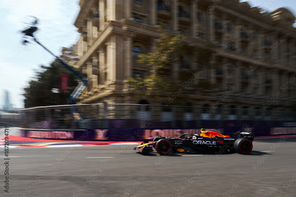 Fototapeta premium BAKU, AZERBAIJAN - SEPTEMBER 19, 2025: Dutch driver Max Verstappen competes in his Red Bull Racing car during the Formula 1 Azerbaijan Grand Prix