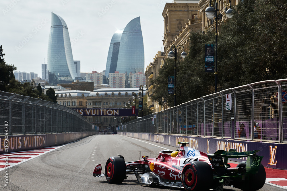 Fototapeta premium BAKU, AZERBAIJAN - SEPTEMBER 19, 2025: British driver Lewis Hamilton competes in his Scuderia Ferrari SF-25 during the Formula 1 Azerbaijan Grand Prix