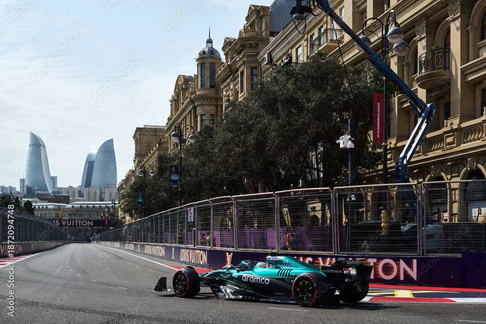 Fototapeta premium BAKU, AZERBAIJAN - SEPTEMBER 19, 2025: Spanish driver Fernando Alonso competes in his Aston Martin Aramco Formula One car during the Azerbaijan Grand Prix
