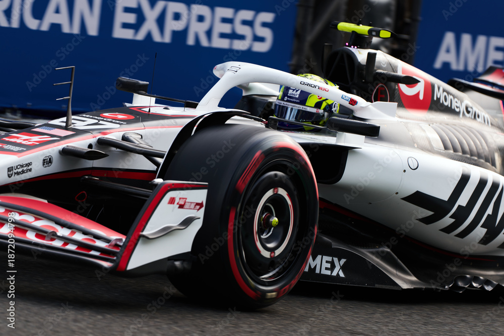 Fototapeta premium BAKU, AZERBAIJAN - SEPTEMBER 19, 2025: A close-up action shot of a Haas F1 Team car on the track during the Formula 1 Azerbaijan Grand Prix at the Baku City Circuit