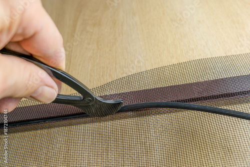 Installing the net into the window aluminium frame or door