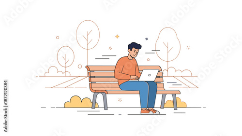 Young male sitting on park bench with laptop in autumn setting