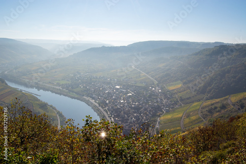 Panoramic view of a valley with river and vineyards