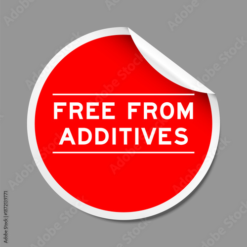 Red color peel sticker label with word free from additives on gray background