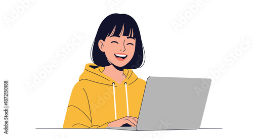 Happy young woman with short dark hair sitting at her desk and laughing while working or browsing on her laptop computer.