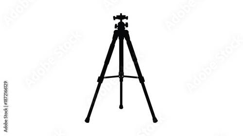 A black tripod stands isolated against a white background silhouette