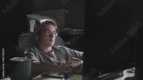 Teen Gamer at Messy Desk Late Night, Cluttered Gaming Setup, Headphones & Mic, Intense Focus, Green Screen Glow, Handheld Shot, Addiction Vibe