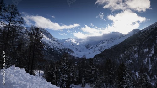 Timelapse of clouds moving over snowy alpine landscape in the Engadin, Switzerland