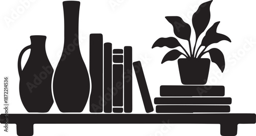 Silhouette of books and decorative items on shelf