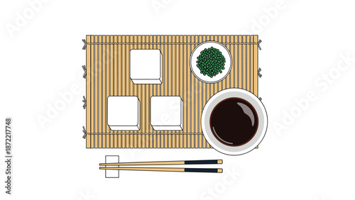 Traditional Japanese appetizer set including tofu cubes, green peas, and soy sauce is presented on a bamboo mat with wooden chopsticks.