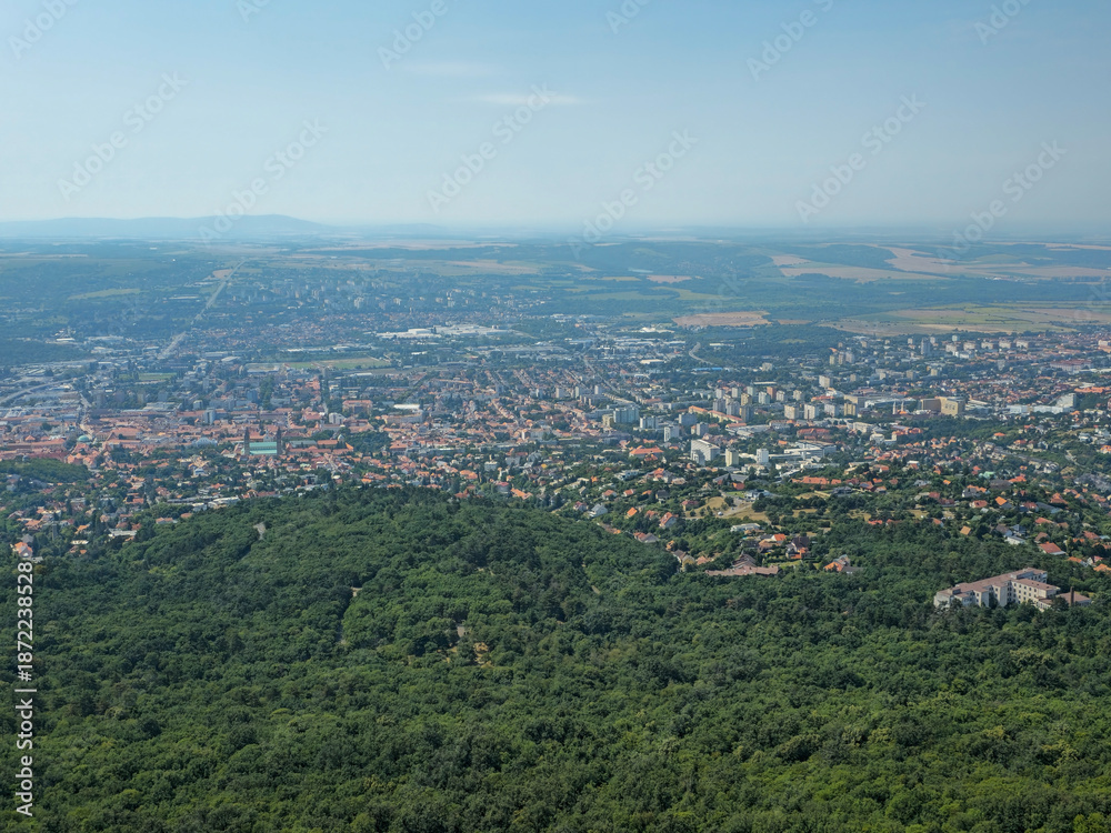Obraz premium Twenty-first image in a series presenting a panoramic view of the city of Pécs, Hungary, photographed from the observation deck of the TV tower. Elevated perspective highlighting the urban landscape, 